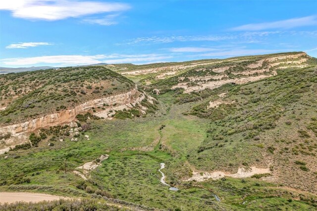 drone / aerial view featuring a mountain view