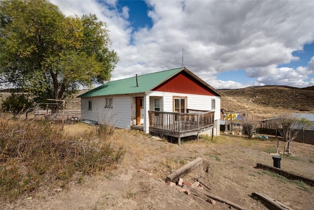 rear view of house with a deck