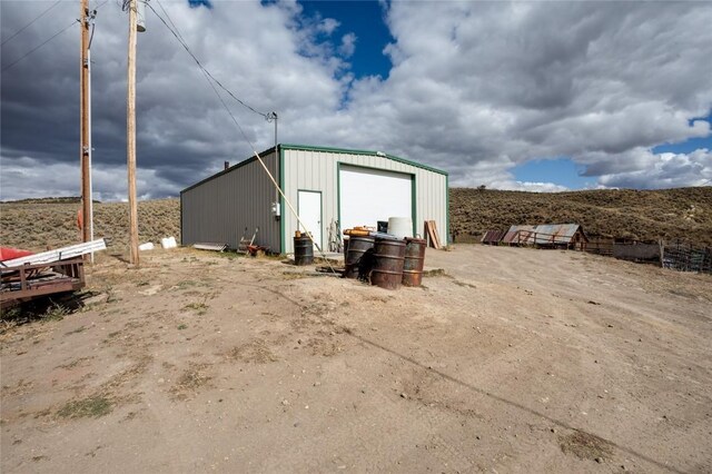 view of outdoor structure featuring a garage