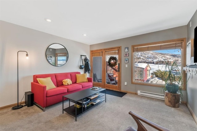 living room featuring carpet floors, baseboards, baseboard heating, and recessed lighting