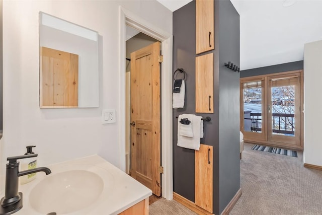 bathroom featuring vanity and baseboards