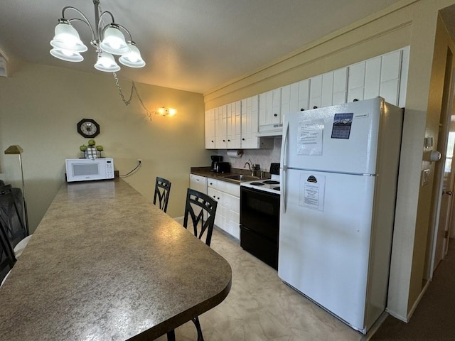 kitchen with white cabinets, sink, white appliances, and hanging light fixtures