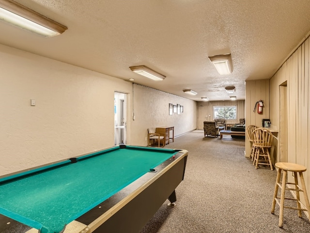 game room featuring carpet floors, a textured ceiling, and billiards