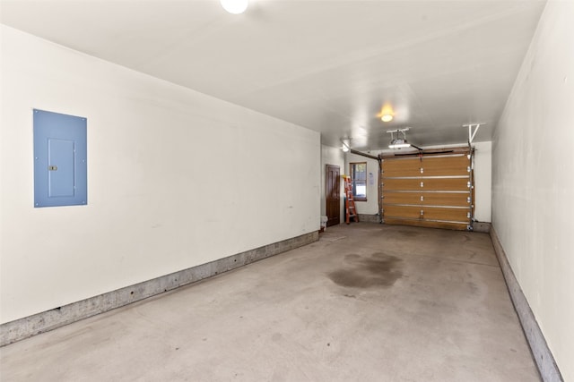 garage with baseboards, electric panel, and a garage door opener