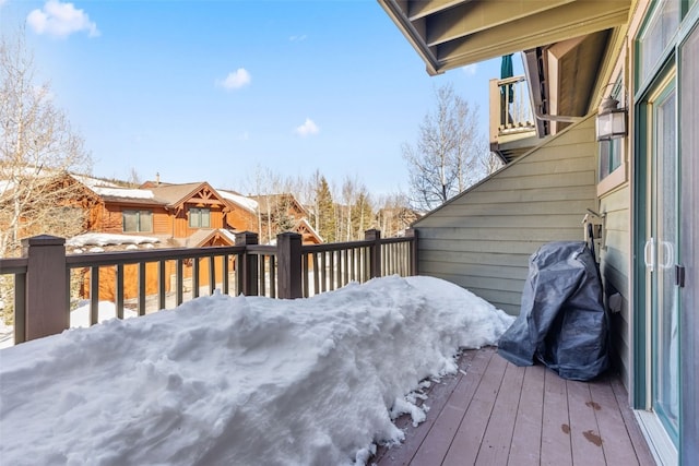 view of snow covered deck