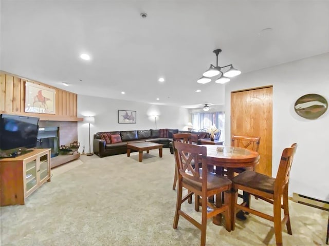 dining area featuring a ceiling fan, recessed lighting, and light carpet