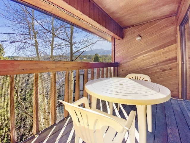 wooden terrace featuring a mountain view