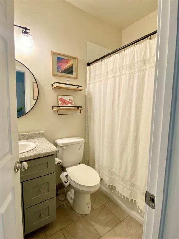 bathroom with tile patterned flooring, toilet, vanity, and shower / bathtub combination with curtain