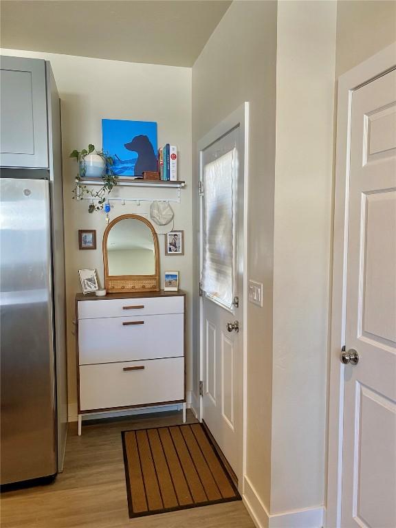 doorway to outside featuring light wood finished floors