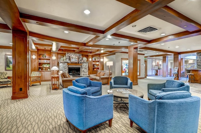 living room featuring built in features, coffered ceiling, light carpet, a stone fireplace, and beamed ceiling