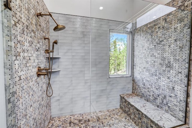 bathroom with a tile shower