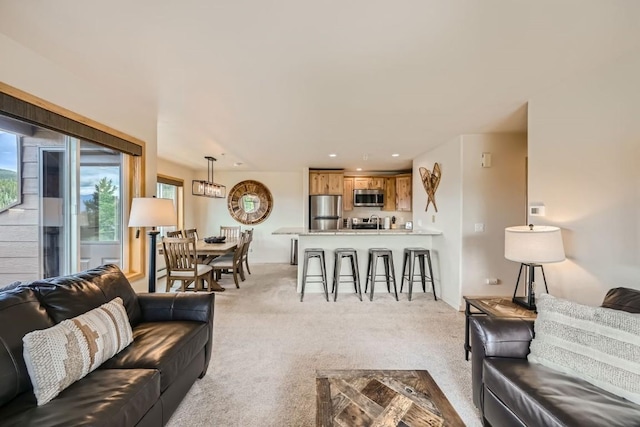 living room with recessed lighting and light colored carpet