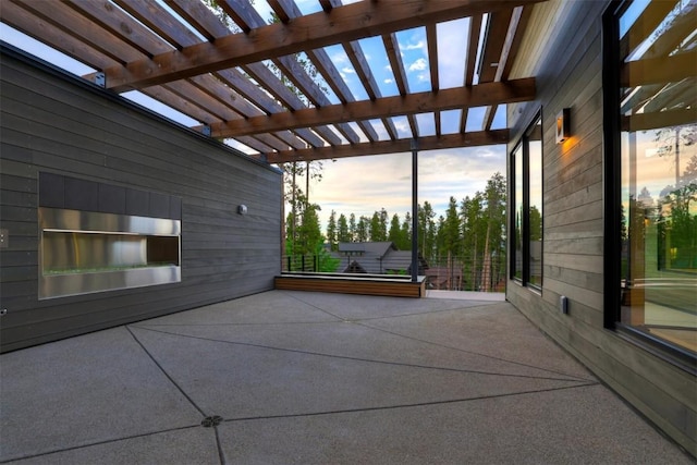 patio terrace at dusk with a pergola