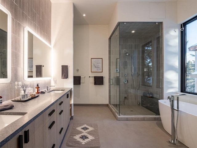 bathroom featuring vanity and plus walk in shower