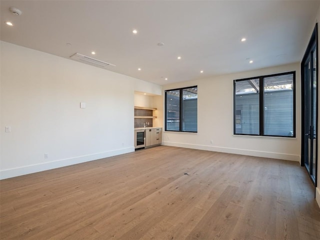 unfurnished living room featuring light wood-type flooring