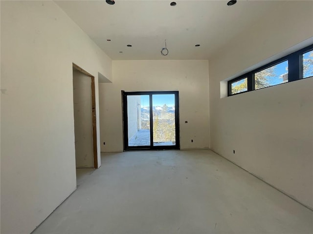 unfurnished room featuring concrete flooring