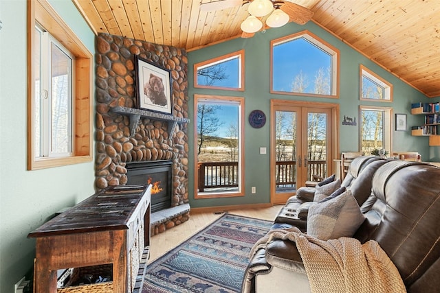 living room featuring ceiling fan, a fireplace, high vaulted ceiling, and wood ceiling