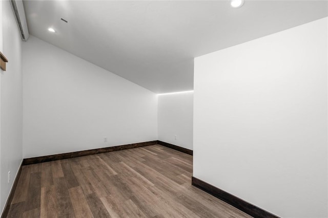 additional living space with lofted ceiling and light wood-type flooring