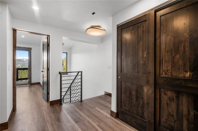 hall with hardwood / wood-style floors