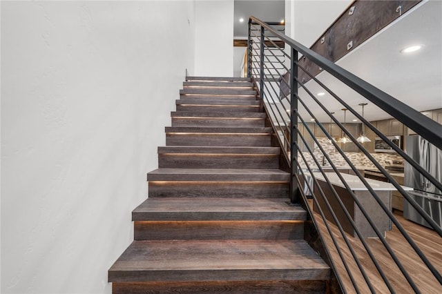 stairway with wood-type flooring