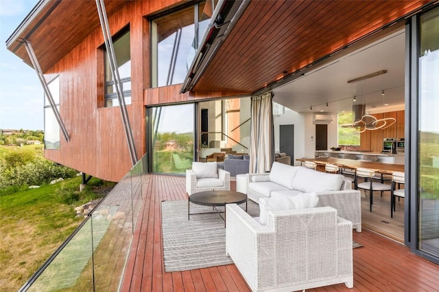 wooden terrace featuring an outdoor hangout area