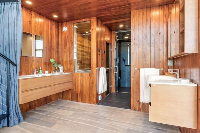 bathroom featuring vanity, wood ceiling, and wood walls