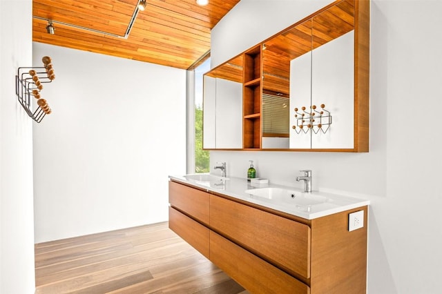 bathroom featuring vanity, hardwood / wood-style floors, and wooden ceiling