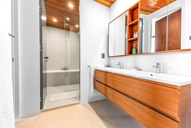 bathroom with vanity, wood ceiling, and walk in shower