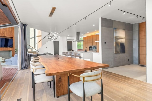 dining room featuring sink and light hardwood / wood-style flooring