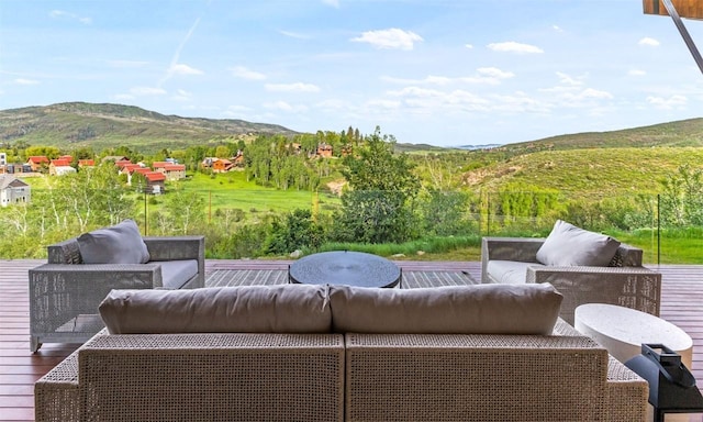 view of patio with an outdoor hangout area and a mountain view