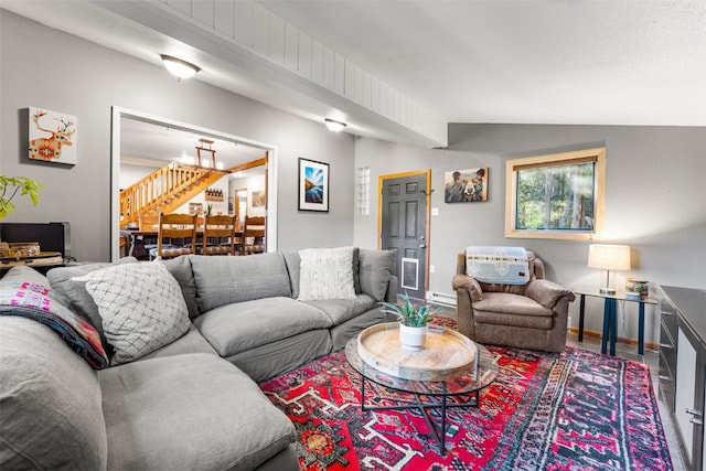 living room with lofted ceiling, hardwood / wood-style floors, and a baseboard radiator