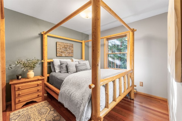 bedroom with hardwood / wood-style floors