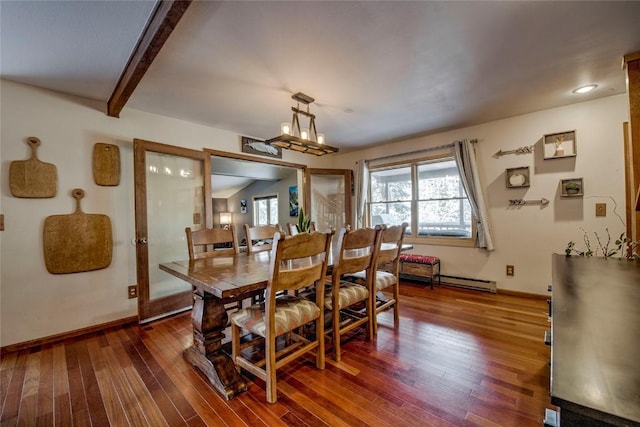 dining area featuring dark hardwood / wood-style flooring and beam ceiling