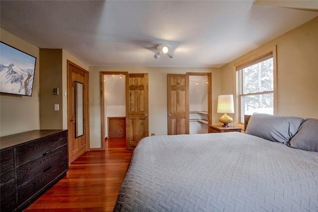 bedroom with ceiling fan and dark hardwood / wood-style flooring