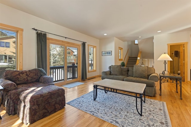 living room with light hardwood / wood-style flooring