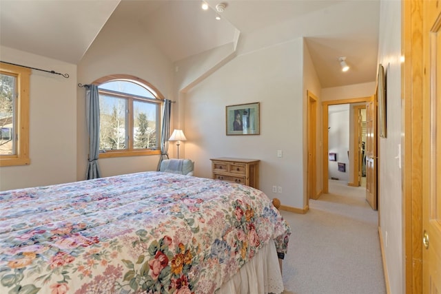 bedroom featuring light carpet and vaulted ceiling