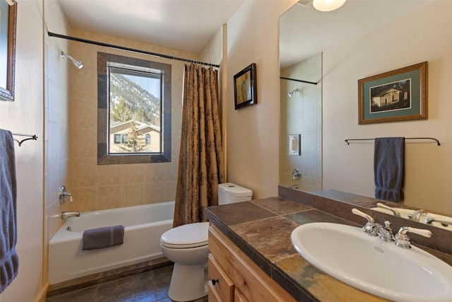 full bathroom featuring vanity, shower / bath combination with curtain, and toilet