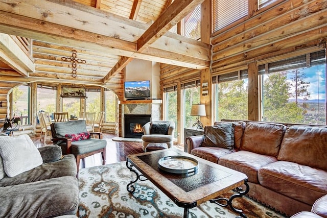 sunroom / solarium featuring lofted ceiling with beams