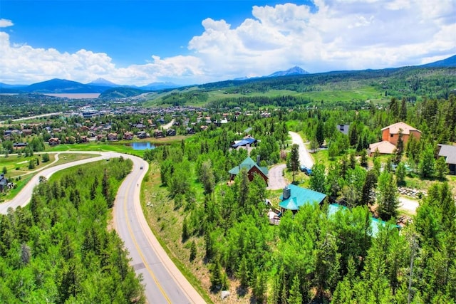 aerial view featuring a water and mountain view