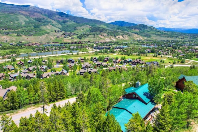 bird's eye view with a water and mountain view