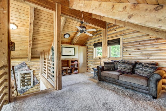 carpeted living room featuring ceiling fan, beam ceiling, wood ceiling, and rustic walls