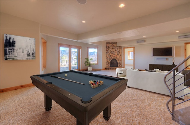 recreation room with a stone fireplace, carpet floors, and billiards