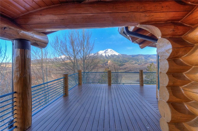 wooden terrace with a mountain view