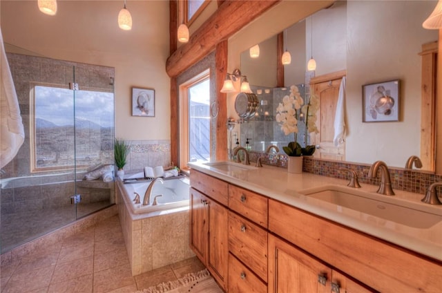 bathroom with a mountain view, tile patterned flooring, vanity, and plus walk in shower