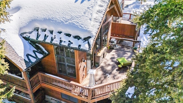 view of home's exterior featuring a wooden deck