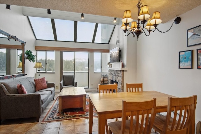 tiled dining room featuring high vaulted ceiling, a textured ceiling, and a notable chandelier