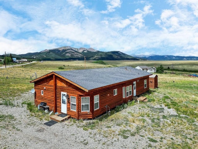 view of side of property featuring a mountain view and a rural view