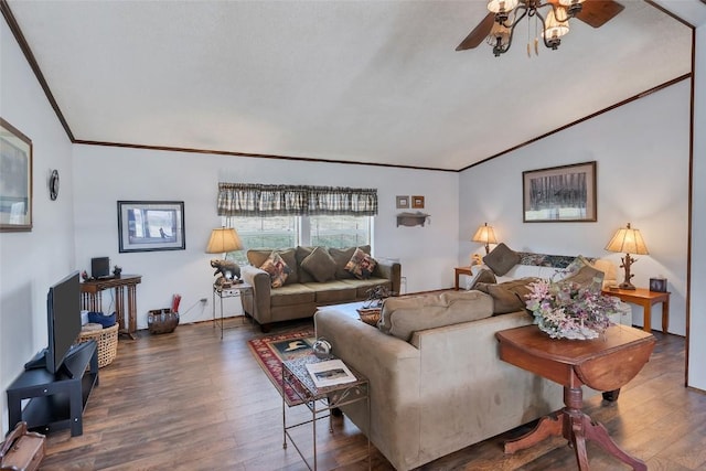 living room with ceiling fan, crown molding, and dark wood-type flooring