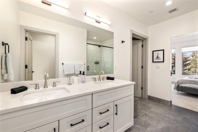 bathroom featuring a shower stall, visible vents, a sink, and ensuite bathroom