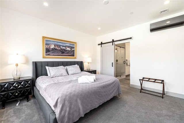 carpeted bedroom with a barn door, visible vents, baseboards, a wall mounted air conditioner, and recessed lighting